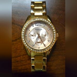 C- Fossil rose gold watch